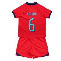 Camiseta Inglaterra Harry Maguire #6 Visitante Equipación para niños Mundial 2022 manga corta (+ pantalones cortos)